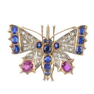 A diamond and gem-set brooch. Designed as a butterfly, set throughout with vari-cut rubies, sapphire
