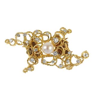 A 1970s cultured pearl and diamond clasp. Designed as a cultured pearl, within a brilliant and singl