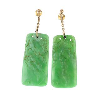 A pair of early 20th century jade ear pendants. Each designed as a rectangular-shape jadeite panel,