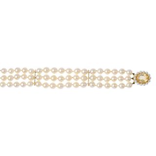 A cultured pearl and citrine bracelet. The cultured pearls, measuring 7mms, with two bar spacers, to