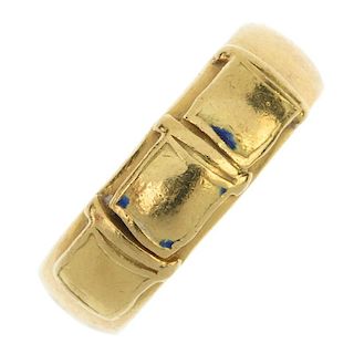 An 18ct gold band ring. The triple square motif, to the plain band. Hallmarks for London, 1972. Ring