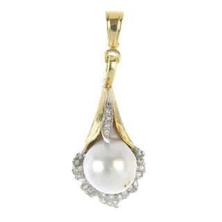 A 1970s cultured pearl and diamond lily pendant. The cultured pearl, measuring 13.4mms, within a sin