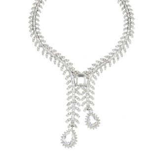 A 14ct gold rock crystal and diamond necklace. The brilliant and baguette-cut diamond articulated li