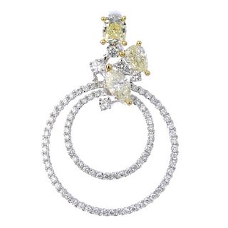 * A diamond and coloured diamond pendant. Designed as two brilliant-cut diamond concentric circles,