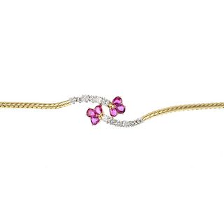 A 1980s 18ct gold ruby and diamond bracelet. The pear-shape ruby trefoil, to the brilliant-cut diamo