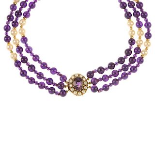 An amethyst and cultured pearl necklace and a pair of amethyst ear studs. The necklace designed as a