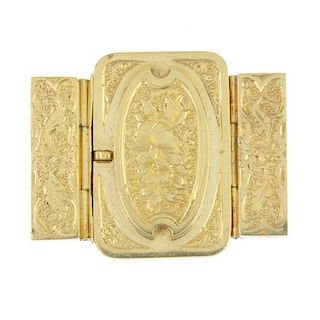 A late 19th century clasp. The rectangular panel, with floral engraved raised centre, to the similar
