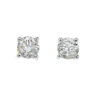 A pair of brilliant-cut diamond ear studs. Estimated total diamond weight 0.60ct, J-K colour, P1-P2