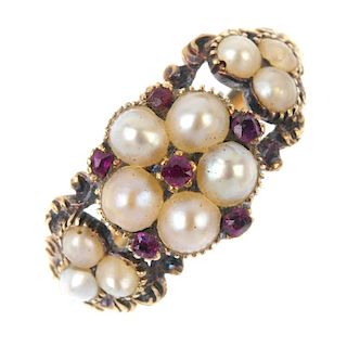 A mid 19th century gold split pearl and ruby ring. The split pearl and cushion-shape ruby accent flo