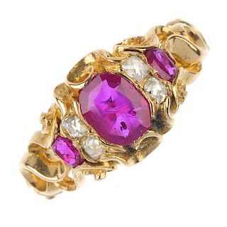 A ruby and diamond dress ring. The oval-shape ruby, to the old-cut diamond spacers and oval-shape ru