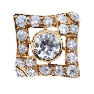 A diamond cluster ring. The old-cut diamond collet, within a similarly-cut diamond lozenge-shape sur
