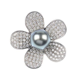 A cultured pearl and diamond flower ring. The grey cultured pearl, measuring 12.8mms, within a pave-