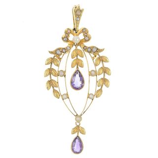 An early 20th century 15ct gold amethyst and split pearl pendant. Designed as two pear-shape amethys