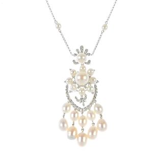 A cultured pearl and diamond necklace. The graduated cultured pearl fringe, suspended from a brillia