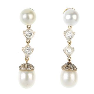 A pair of cultured pearl and diamond ear pendants. Each designed as a cultured pearl drop with rose-