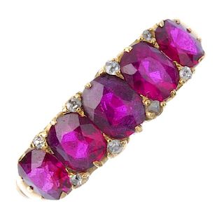 A late Victorian 18ct gold ruby and diamond five-stone ring. The oval-shape ruby graduated line, wit