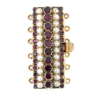An early 20th century gold foil-back garnet and split pearl clasp. Designed as five alternating foil