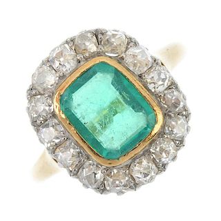 An emerald and diamond cluster ring. The rectangular-shape emerald collet, within an old-cut diamond