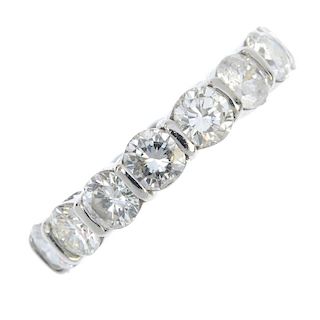 A platinum diamond full-circle eternity ring. Designed as a series of brilliant-cut diamonds, with b