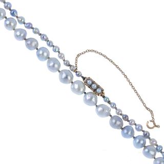 A cultured pearl single-strand necklace. The graduated grey cultured pearls, measuring 7 to 3mms, to