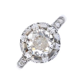 A diamond single-stone ring. The old-cut diamond, within an illusion-setting, to the single-cut diam