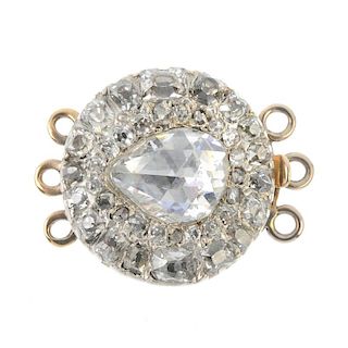 A late 19th century gold and silver diamond cluster clasp. The pear-shape foil-back rose-cut diamond