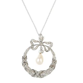 An early 20th platinum century diamond and cultured pearl pendant. The old-cut diamond and cultured