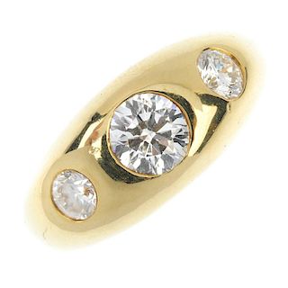 A gentleman's 18ct gold diamond three-stone ring. The brilliant-cut diamond graduated line, inset to