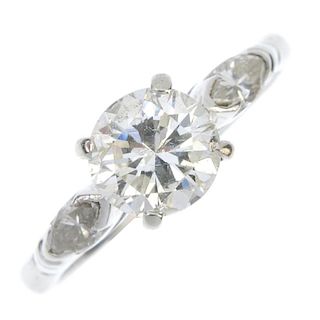 An 18ct gold diamond single-stone ring. The brilliant-cut diamond, to the marquise-shape diamond sid