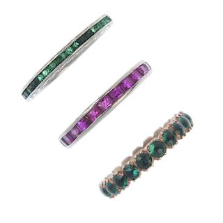 A selection of three emerald and ruby full-circle eternity rings. To include a late 19th century eme