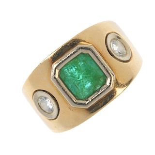 A gentleman's emerald and diamond dress ring. The rectangular-shape emerald collet, to the old-cut d