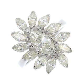 A diamond dress ring. The marquise-shape diamond, within a similarly-cut diamond surround, to the pl