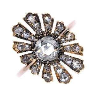 A diamond floral cluster ring. The rose-cut diamond, within a similarly-cut diamond petal surround,