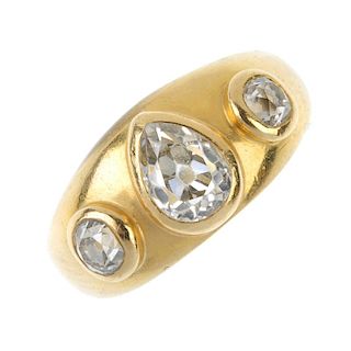 A diamond three-stone band ring. The pear-shape old-cut diamond collet, to the old-cut diamond colle