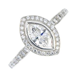 A platinum diamond cluster ring. The marquise-shape diamond, within a brilliant-cut diamond surround