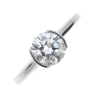 An 18ct gold diamond single-stone ring. The brilliant-cut diamond, within a partial collet setting,