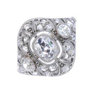 A diamond cluster ring. The old-cut diamond collet, to the similarly-cut diamond collet sides, withi