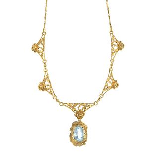 An aquamarine foliate necklace. The replacement oval-shape aquamarine foliate drop, suspended from a