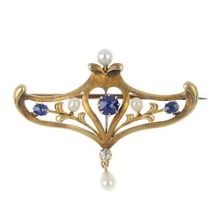 An early 20th century 14ct gold sapphire, diamond and seed pearl brooch. The circular-shape sapphire