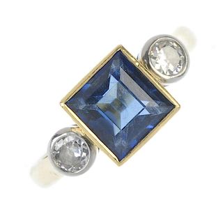 BOODLE & DUNTHORNE - an 18ct gold sapphire and diamond three-stone ring. The square-shape sapphire,