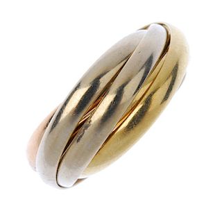 CARTIER - an 18ct gold 'Trinity' ring. Of tri-colour design, comprising three interwoven bands. Sign