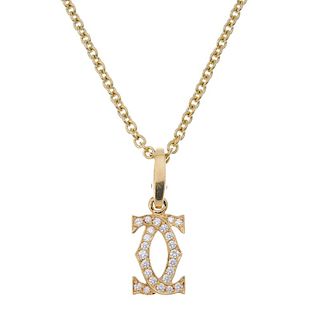 CARTIER - an 18ct gold diamond pendant. Designed as two brilliant-cut diamond crossover C's, suspend