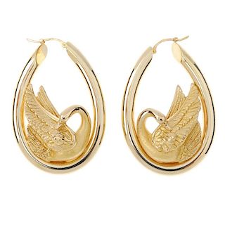 CHARLES GARNIER - a pair of ear hoops. Each designed as a textured preening swan, within a oval-shap