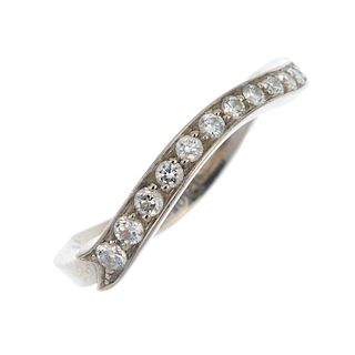 DIOR - a diamond band ring. The brilliant-cut diamond curved line stylised ribbon, to the shaped ban