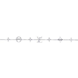 LOUIS VUITTON -  a monogram bracelet. Designed as a series of Louis Vuitton signature monograms, to