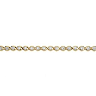 TIFFANY & CO. - a diamond line bracelet. Designed as a series of brilliant-cut diamond collets, to t