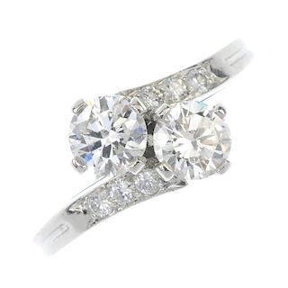 TIFFANY & CO. - a 1960s platinum diamond two-stone crossover ring. The brilliant-cut diamonds, to th