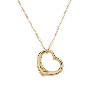 TIFFANY & CO. - an 18ct gold 'open heart' pendant, by Elsa Peretti, for Tiffany & Co. The stylised h