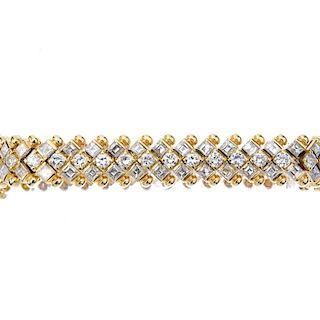 A diamond bracelet. Comprising a brilliant-cut diamond line, with square-shape diamond double spacer