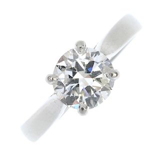 A platinum diamond single-stone ring. The brilliant-cut diamond, estimated weight 1.13cts, to the ta